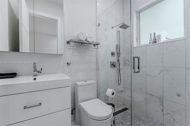 bathroom with vanity, toilet, and an enclosed shower