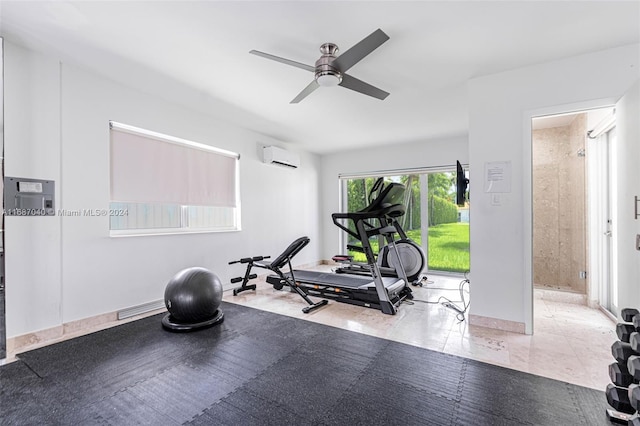 exercise area with a wall mounted AC and ceiling fan