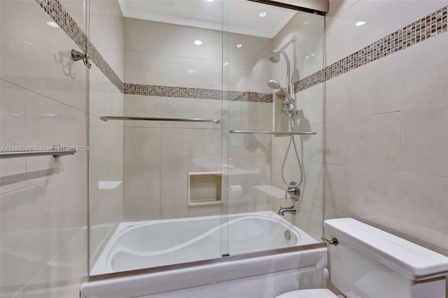 bathroom featuring shower / bath combination with glass door, toilet, and crown molding