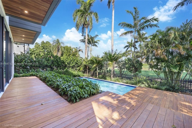 view of swimming pool featuring a deck