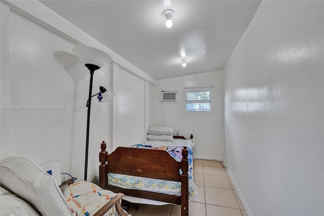 tiled bedroom featuring lofted ceiling and a wall unit AC