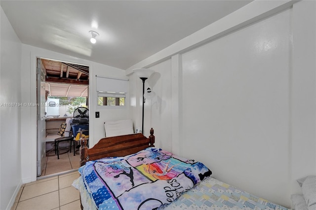 bedroom featuring light tile patterned flooring