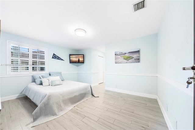 bedroom with light wood-type flooring