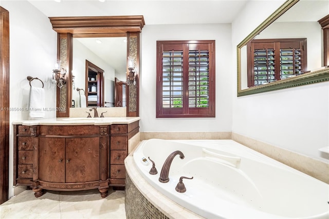 bathroom with vanity and a relaxing tiled tub