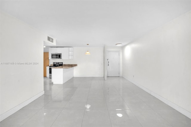 interior space featuring light tile patterned flooring