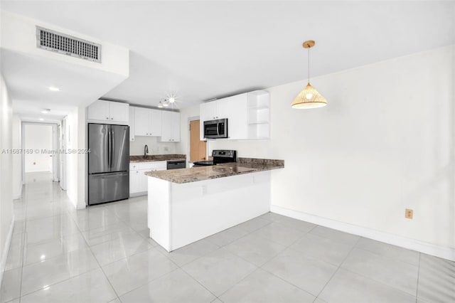 kitchen with stainless steel appliances, white cabinetry, kitchen peninsula, light tile patterned floors, and pendant lighting