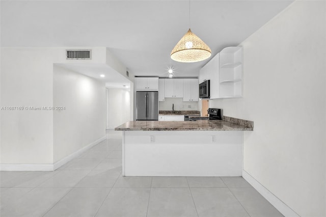 kitchen with hanging light fixtures, kitchen peninsula, appliances with stainless steel finishes, and white cabinets