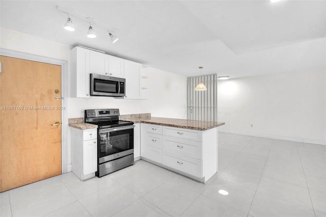 kitchen with kitchen peninsula, white cabinets, decorative light fixtures, and stainless steel appliances