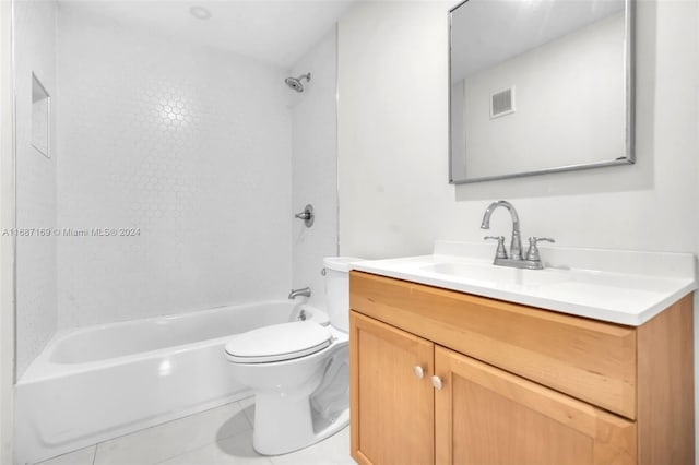 full bathroom with tile patterned flooring, vanity, toilet, and tiled shower / bath