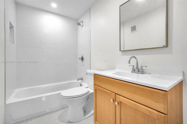 full bathroom featuring tile patterned floors, vanity, toilet, and tiled shower / bath