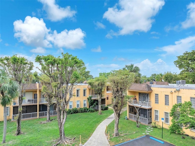 surrounding community featuring a lawn