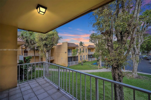 view of balcony at dusk