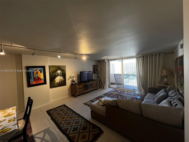 tiled bedroom with access to outside and track lighting