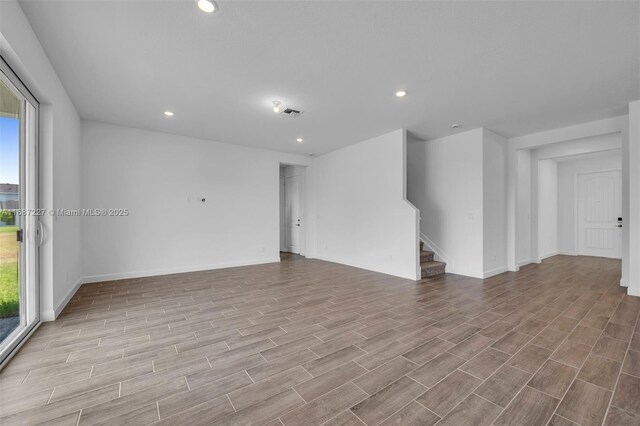 unfurnished living room featuring light hardwood / wood-style floors