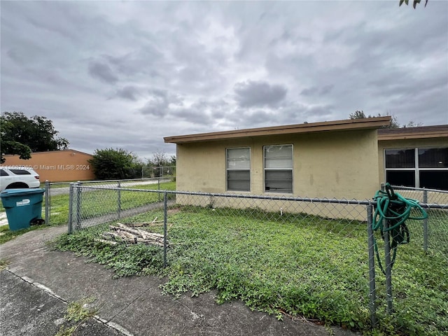 view of side of home featuring a yard