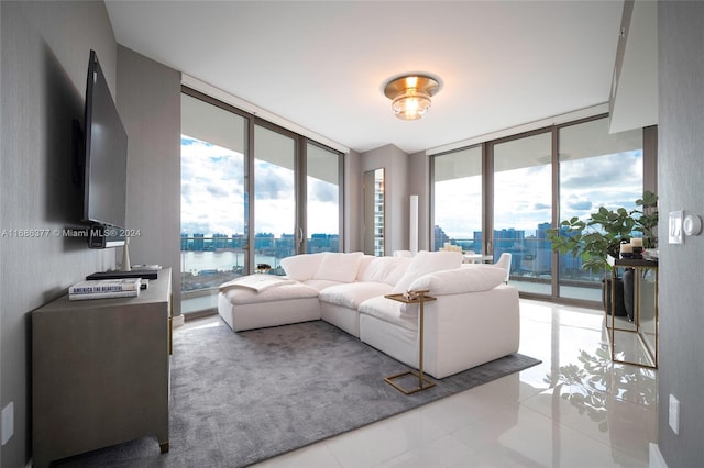 tiled living room with a wealth of natural light and a wall of windows