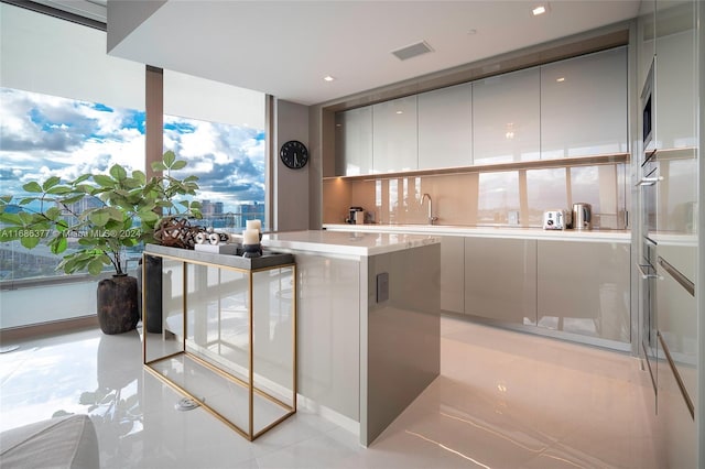 kitchen featuring floor to ceiling windows