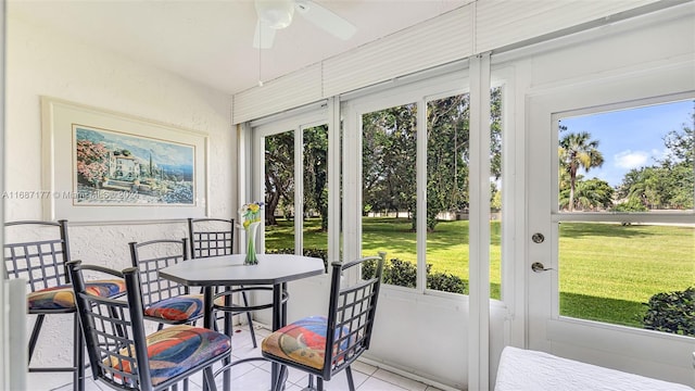 sunroom / solarium with ceiling fan