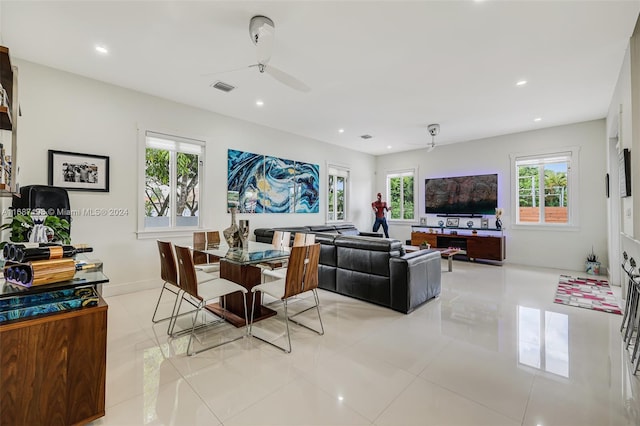 living room featuring light tile patterned flooring and ceiling fan