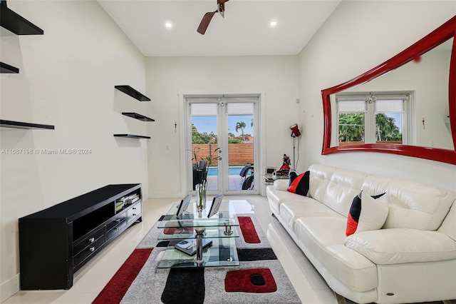 living room featuring french doors, a healthy amount of sunlight, and ceiling fan