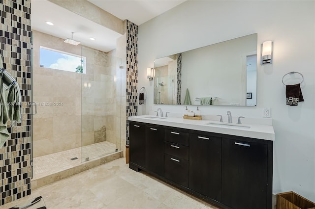 bathroom with vanity and a shower with shower door