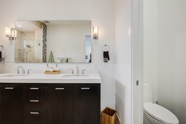 bathroom featuring toilet, walk in shower, and vanity