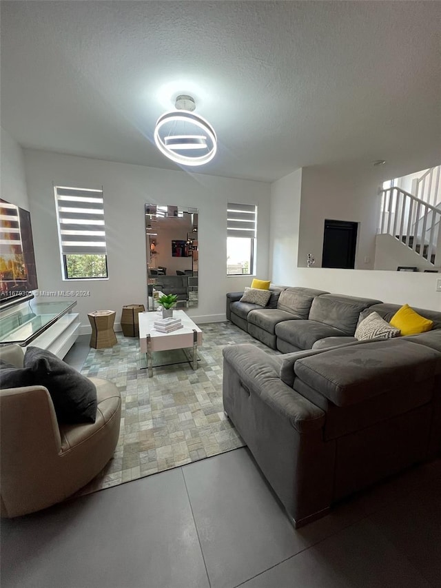 living room with a textured ceiling