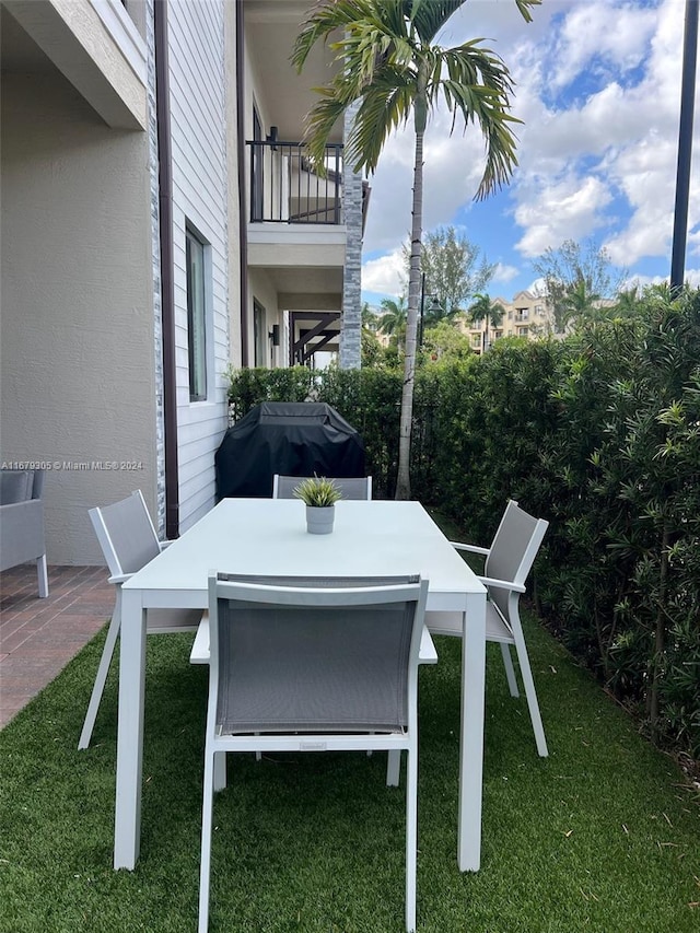 view of patio with a balcony and area for grilling