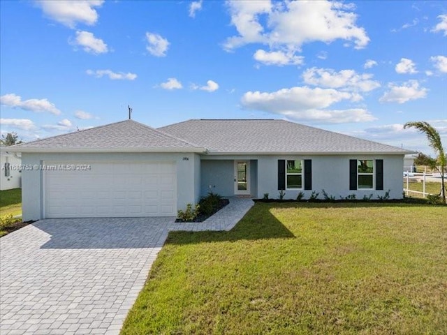 ranch-style house with a front yard and a garage