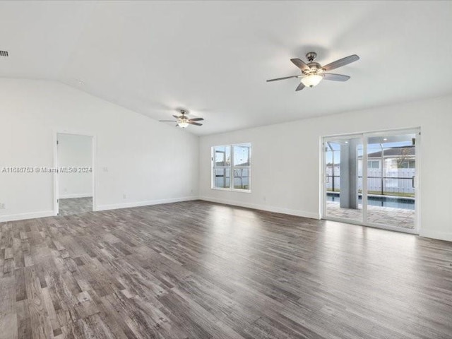 spare room featuring ceiling fan, lofted ceiling, and hardwood / wood-style floors