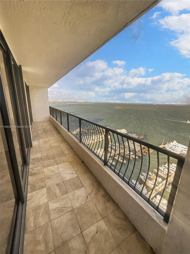 balcony featuring a water view