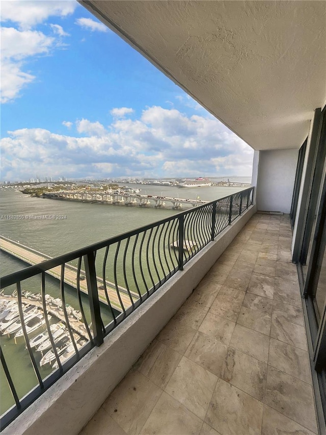 balcony featuring a water view