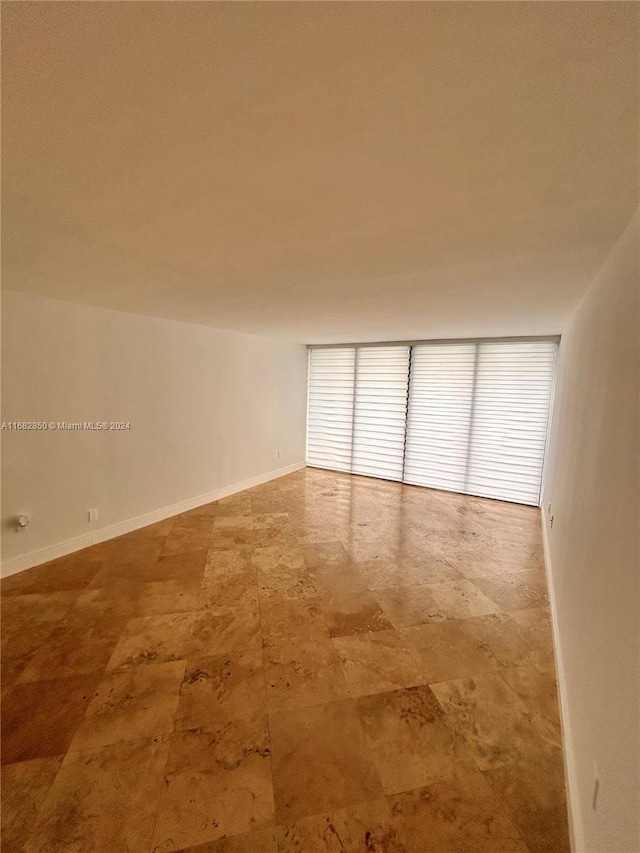 555 NE 15th St Unit 24B, Miami, FL 33132 - empty room with baseboards