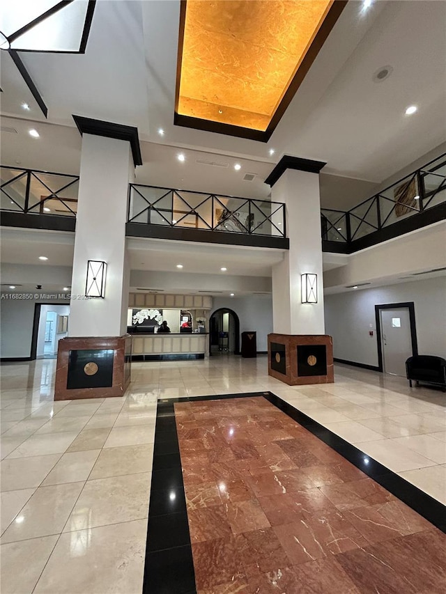 555 NE 15th St Unit 24B, Miami, FL 33132 - building lobby featuring a high ceiling and recessed lighting