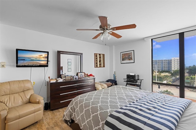 1600 S Ocean Dr Unit 5J, Hollywood, FL 33019 - bedroom featuring light wood-style floors, expansive windows, and ceiling fan