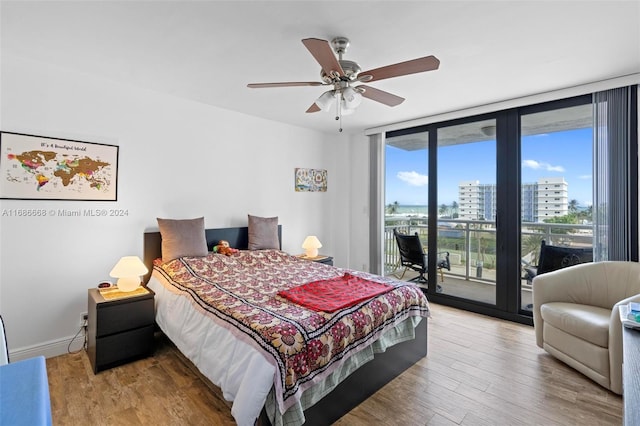 1600 S Ocean Dr Unit 5J, Hollywood, FL 33019 - bedroom featuring floor to ceiling windows, access to outside, wood finished floors, a view of city, and ceiling fan