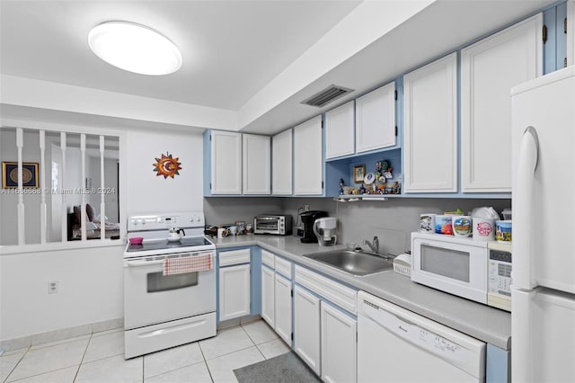 1600 S Ocean Dr Unit 5J, Hollywood, FL 33019 - kitchen with white appliances, a sink, light tile patterned flooring, light countertops, and open shelves