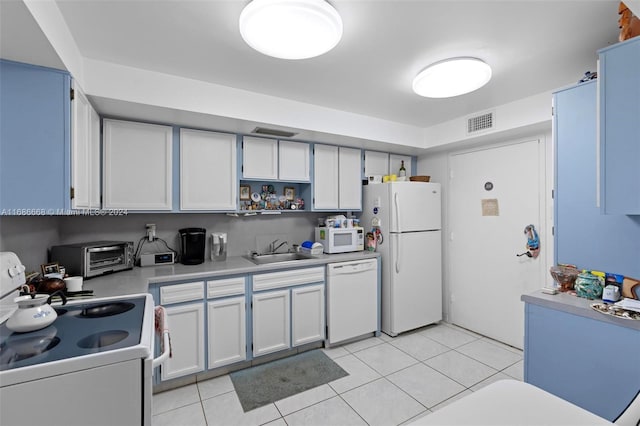 1600 S Ocean Dr Unit 5J, Hollywood, FL 33019 - kitchen with white appliances, a sink, light countertops, open shelves, and light tile patterned floors