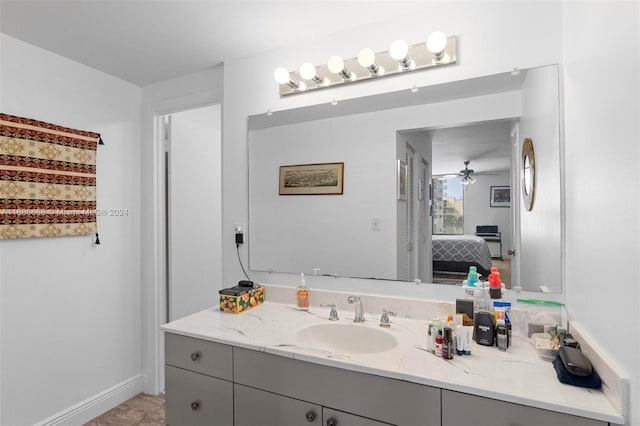 1600 S Ocean Dr Unit 5J, Hollywood, FL 33019 - bathroom with vanity, a ceiling fan, baseboards, and ensuite bathroom