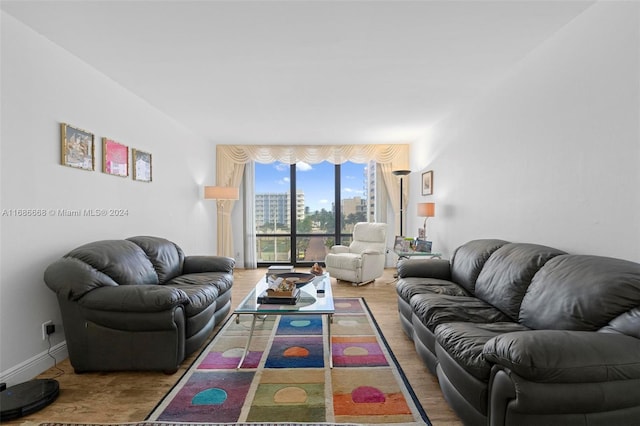 1600 S Ocean Dr Unit 5J, Hollywood, FL 33019 - living room with a wall of windows, a city view, and wood finished floors
