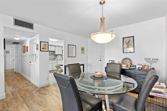 1600 S Ocean Dr Unit 5J, Hollywood, FL 33019 - dining room with light wood-type flooring and baseboards