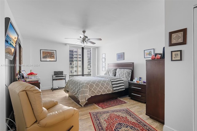 1600 S Ocean Dr Unit 5J, Hollywood, FL 33019 - bedroom featuring light wood-style floors, a ceiling fan, and baseboards