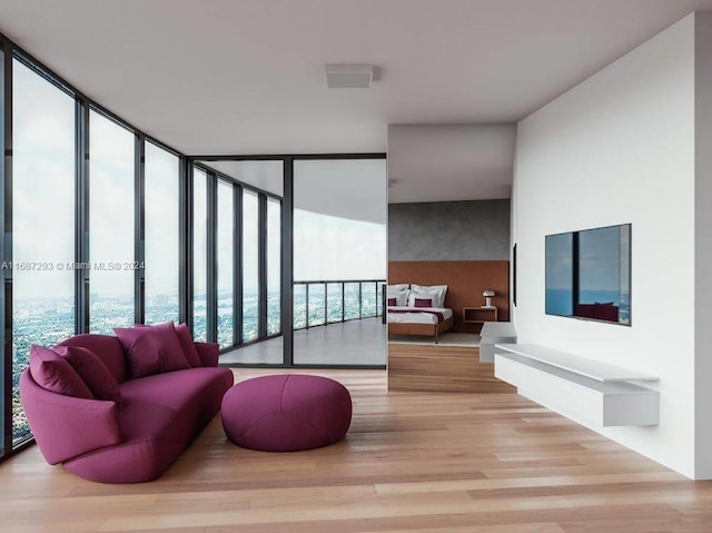 living room featuring light wood-type flooring and a wall of windows