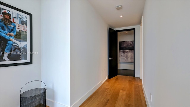 corridor featuring light hardwood / wood-style floors