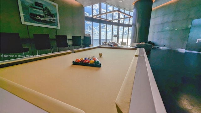 recreation room with a water view and billiards