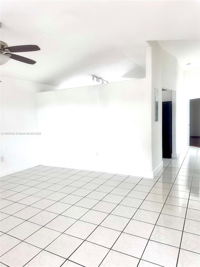 empty room featuring ceiling fan and light tile patterned flooring