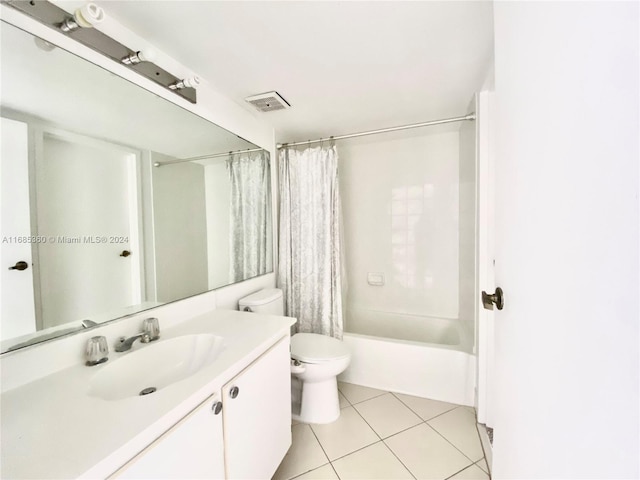 full bathroom featuring vanity, tile patterned floors, toilet, and shower / bathtub combination with curtain