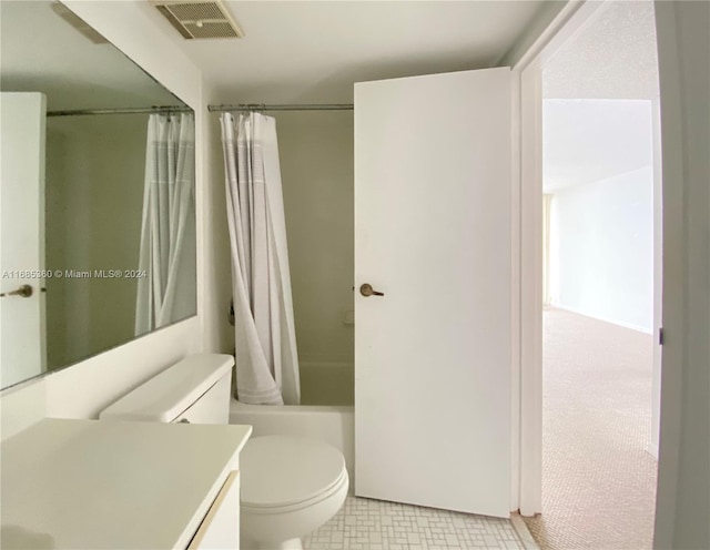 full bathroom with vanity, shower / bath combo, and toilet