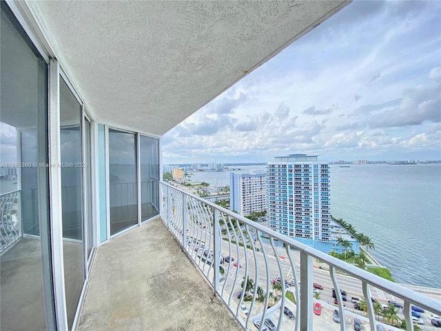 balcony featuring a water view