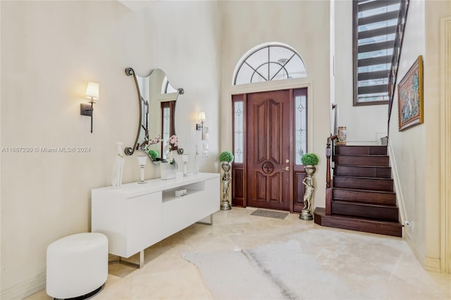 entryway featuring a high ceiling